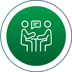 Two people talking at a table icon.